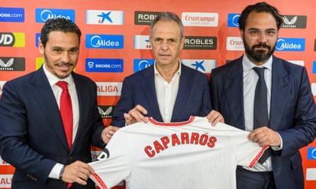 Joaquín Caparros (centre) is welcomes at a presentation with club president José María del Nido Carrasco and sporting director Victor Orta