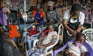 Children have their hair braided at the Mama Brayo beauty salon in Kibera, Nairobi.