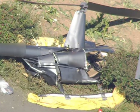 heavily damaged helicopter on the ground