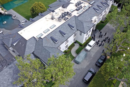 The home of Sean ‘Diddy’ Combs is seen during a raid by federal law enforcement agents on 25 March 2024 in Los Angeles, California.