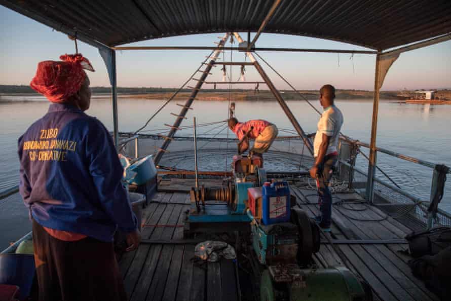 Esnath Munkuli with Jimmy and Talent Siyakanyowa on the rig on the Zambezi River