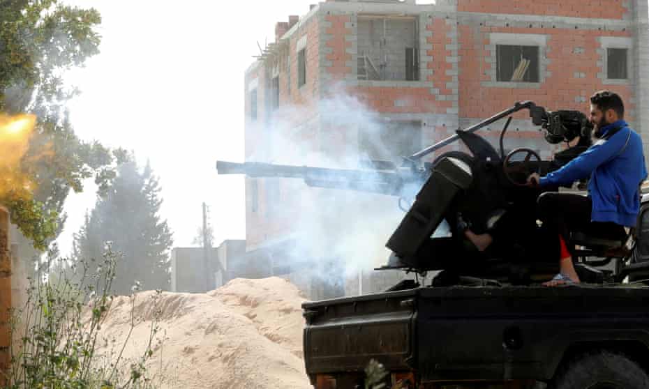 A member of the Tripoli government forces fires during a fight with eastern troops.