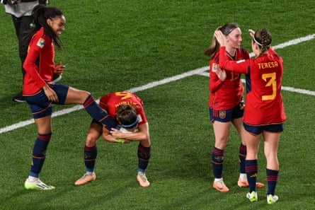 Aitana Bonmatí (centre-left) kisses the boot of Salma Paralluelo after her goal against Sweden.