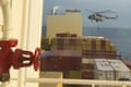 An image made from a video provided to the Associated Press by a Middle East defence official shows a helicopter raid targeting a vessel near the strait of Hormuz on Saturday. The defence official spoke on condition of anonymity to discuss intelligence matters.