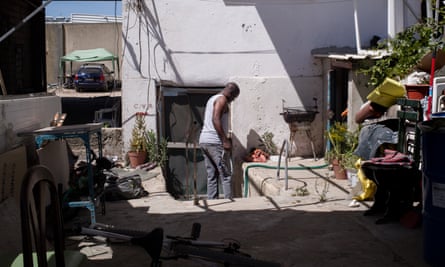 Lizandro Batista de Sousa Pontes outside his rundown home