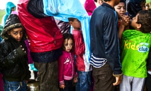 Child refugees queuing for food at the makeshift camp at Idomeni, northern Greece.