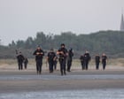 Footage shows French police clashing with people on beach as they try to leave in small boat