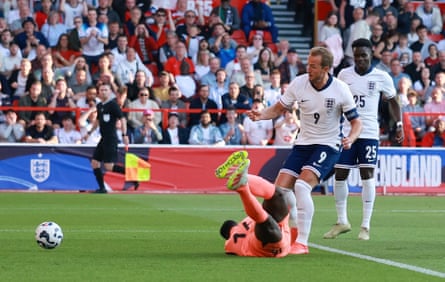 Harry Kane pounces to score past Édouard Mendy and put England ahead.