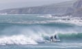 Surfers in the waves at Garrettstown, West Cork