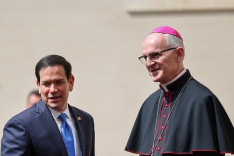 Prefect of the Papal Household Archbishop Petar Rajič welcomes US secretary of state Marco Rubio as he arrives at the San Damaso courtyard to meet Pope Leo XIV at the Vatican.