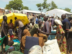 Reunited with old friends at the registration area after a gruelling journey from South Sudan to Uganda.