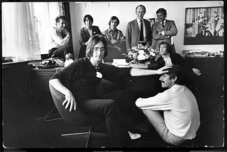 Apple in June 1968. Back row (L-R) includes Denis O’Dell, Paul McCartney, Alexis Mardes, Peter Brown (behind John Lennon’s head), Brian Levis and Ron Kass; Neil Aspinal sits in the middle ground; in the foreground, John Lennon and Derek Taylor.
