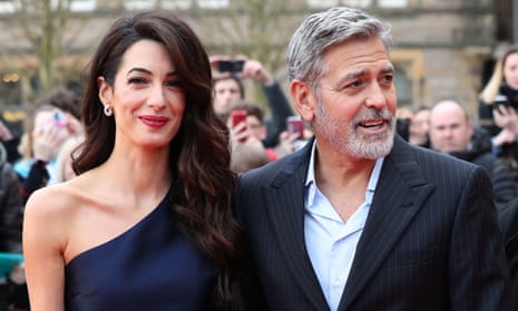 George and Amal Clooney, representing the Clooney Foundation for Justice, arriving at a charity gala at the McEwan Hall in Edinburgh. 