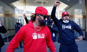 Staten Island-based Amazon.com Inc distribution center union organizer Chris Smalls (left) and another union worker celebrate their victory.