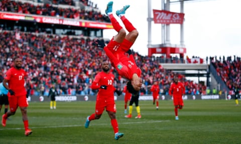 Canada's Tajon Buchanan flips upside down in celebration after scoring against Jamaica