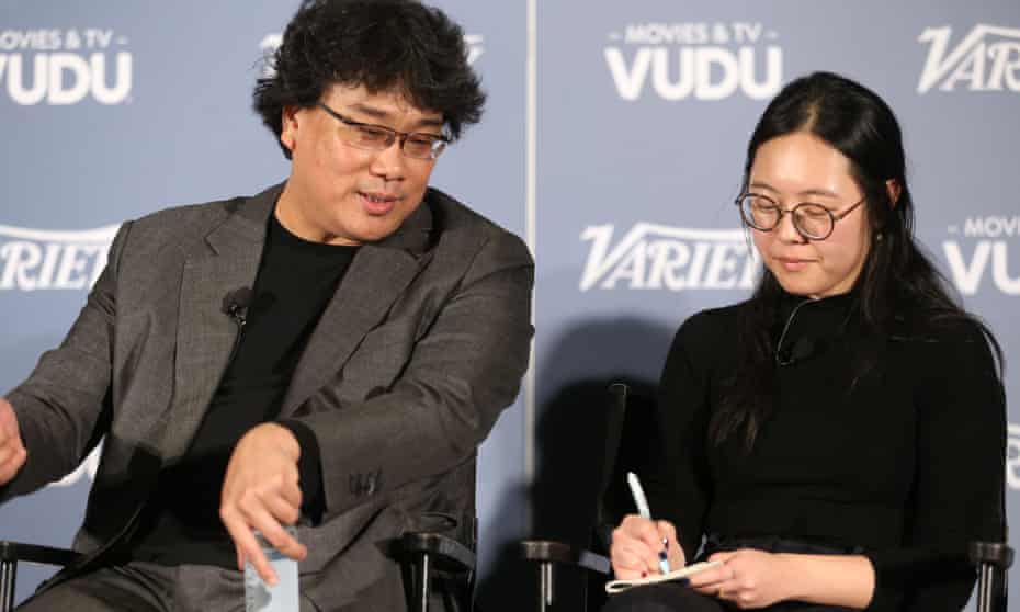 Bong Joon Ho and Sharon Choi at a Parasite press conference in December.