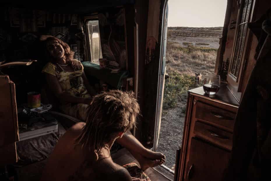 Lili and Misha relax in his motorhome in Lagoa do Santo André, Portugal.