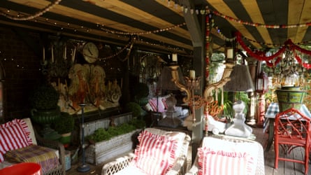 The inside of a pergola, with old fashioned furniture.