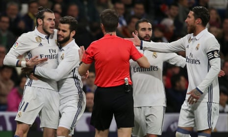 Gareth Bale has to be held back from confronting the referee after being sent off during Real Madrid’s 3-3 draw at home to Las Palmas