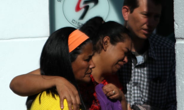 Relatives of victims of a series of street attacks arrive at the Legal Medical Institute in São Paulo state, Brazil, on Friday.