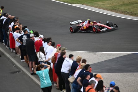 Lewis Hamilton is watched by spectators astatine nan Hungarian Grand Prix.