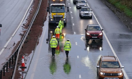 Police in attendance as flood water is cleared from the M9 at Stirling.