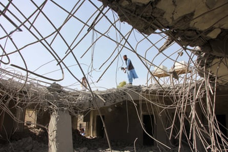 People on the roof of a destroyed building