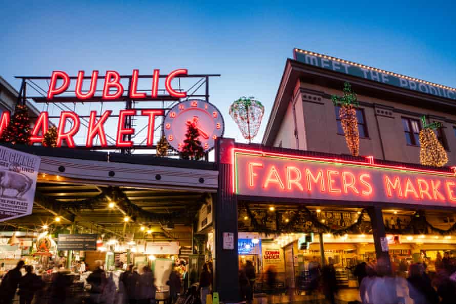 Seattle’s Pike Place Market, with its familiar neon-lit clock and brass pig