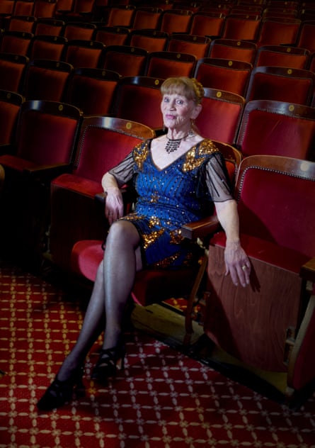 Jacquie Toye sits in seat of a theatre