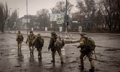 Ukrainian military move through the streets of Bakhmut, Ukraine, on 17 December, 2022.