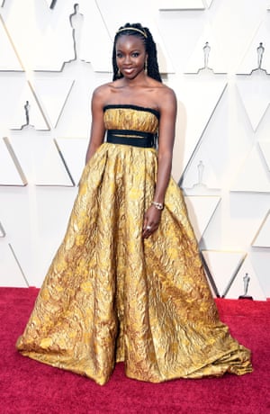 Black Panther actor Danai Gurira wore a strapless gold gown from Brock Collection (famed for their trademark romantic flourishes), but it was her hair braids – created by celebrity hairstylist Larry Sims – and matching headband that upped the glam and earned her fashion kudos by tapping into one of Spring's biggest trends
