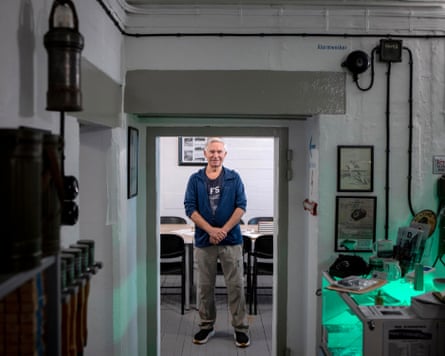 Knut Støre stands in a doorway in the bunker museum in Bødo, Norway.