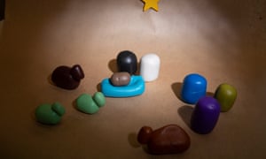 A minimalist birth scene made of plasticine.