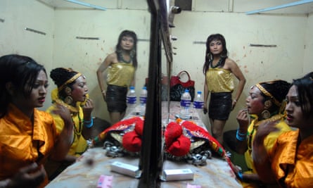 Nepalese transgender people get ready for a performance to mark the International day against homophobia in Kathmandu, Nepal.