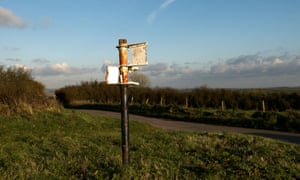 remains of signpost on Eggardon hill in Dorset devoid of any places names.