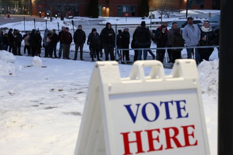 People line up to vote during the 2024 Republican presidential primary at Pinkerton Academy in Derry, New Hampshire.