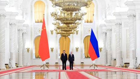 Xi Jinping invites Vladimir Putin to China at Kremlin meeting – video