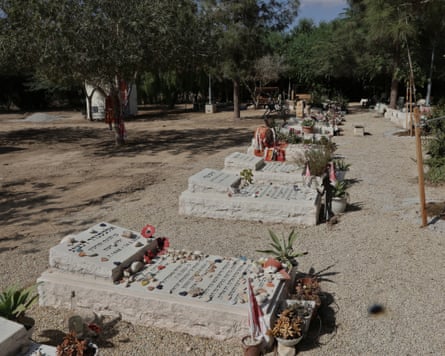 Graves covered with flowers and tributes