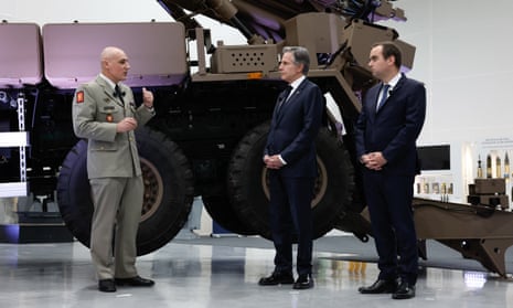 US secretary of state Antony Blinken (C) and France's armed forces minister Sebastien Lecornu (R) listen to Maj Gen Jean-Michel Guilloton at the headquarters of Nexter Systems in Versailles, near Paris.