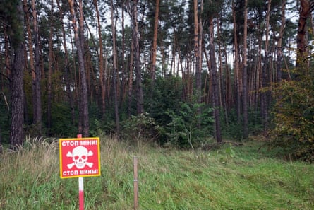 A mine warning sign in the forest near the Ukrainian village of Zalissia north east of Kyiv.