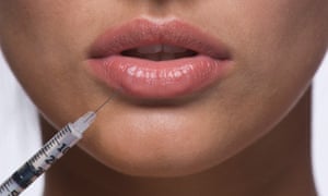 young woman getting a lip injection