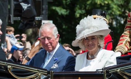 Charles and Camilla taking part in a royal procession along The Mall.