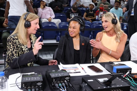 Dawn Staley and Sarah Kustok speak with WNBA commissioner Cathy Engelbert during the 2022 Commissioner’s Cup championship game in Chicago.