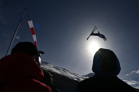 Spectators watch Hanna Huskova in action during qualification for the women’s aerials