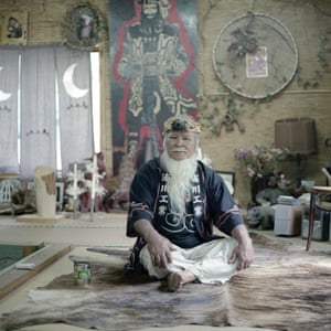 Ainu elder Haruzo Urakawa in his home. Kamuy Mintara, meaning `Playground of Gods`, is a Cise, a traditional Ainu home, that 75 years old Haruzo Urakawa built by himself in the mountains outside of Tokyo. Here, he lived as close as possible to the traditional Ainu lifestyle which, as a child in Hokkaido, he had learned from his father.