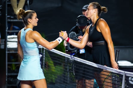 Maria Sakkari (left) shakes hands with Aryna Sabalenka after being well beaten in their round-robin match.