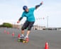 Darren Miles weaving round cones on a skateboard