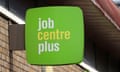 A lime-green-coloured Jobcentre Plus sign