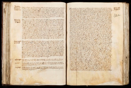 An open manuscript showing densely written justified medieval text