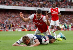 Harry Kane goes to ground under a challenge from Arsenal’s Sokratis Papastathopoulos.